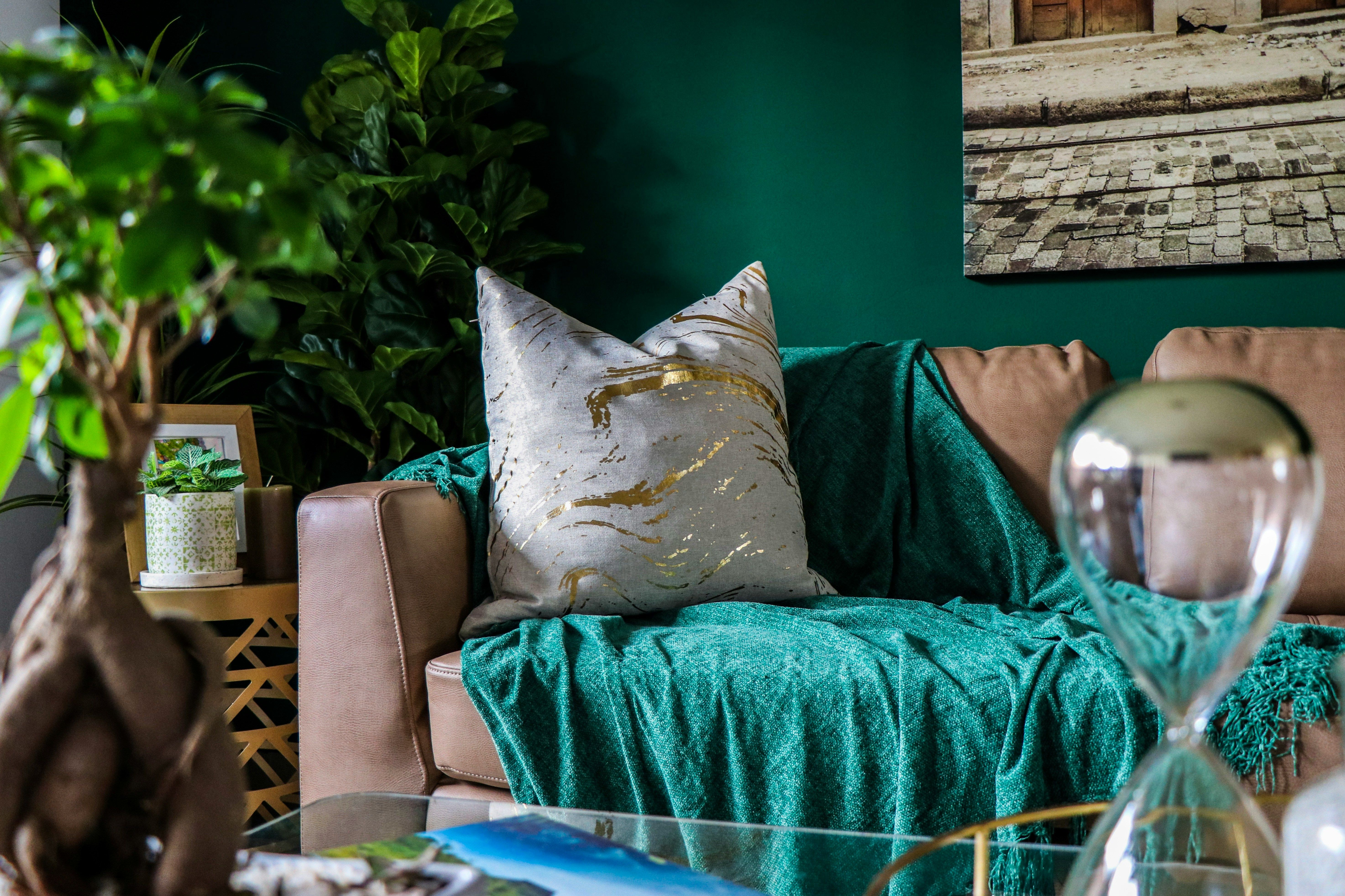 Living room with sage green walls inspired by nature for a biophilic home design